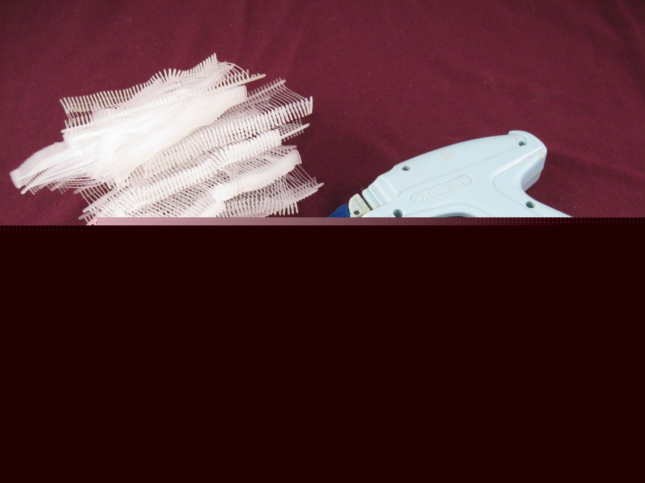 Fabric tagging gun & needles - store display fixtures
