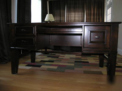 Solid wood desk and chair from ashley furniture. 