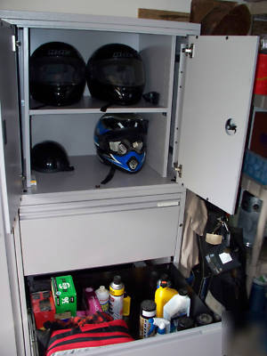 Used 66H x 42W metal motorcycle gear storage cabinet