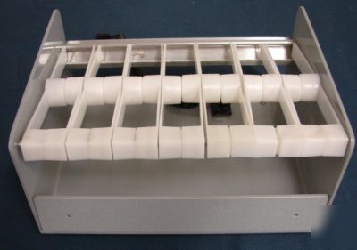 Label dispenser, holds 7 rolls