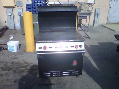 Wolf comercial even temperature top stove with shelf 