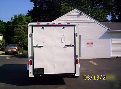 2010 6X12 haulin trailer side door, rear ramp, white